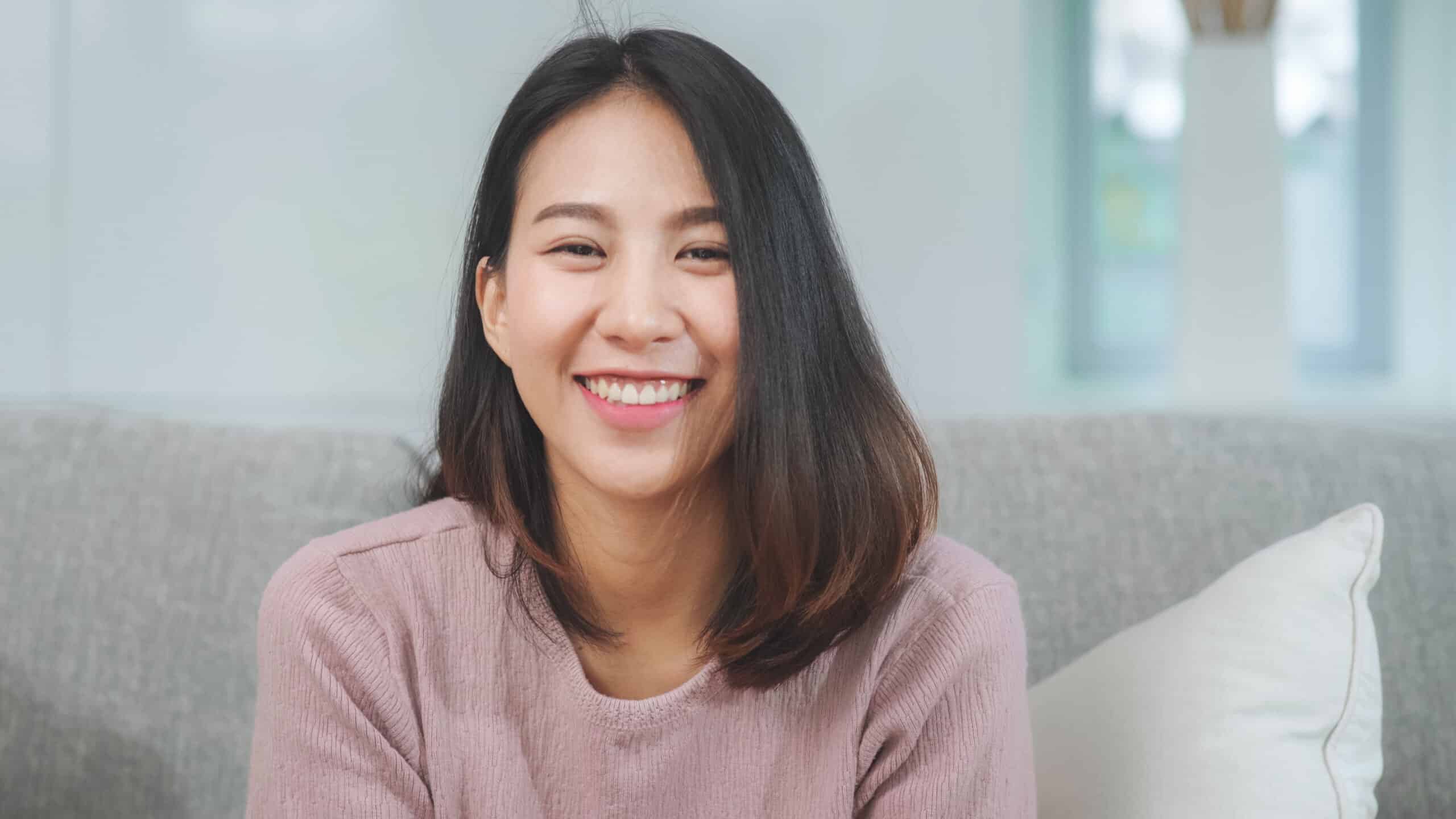 Teenager,Asian,Woman,Feeling,Happy,Smiling,And,Looking,To,Camera